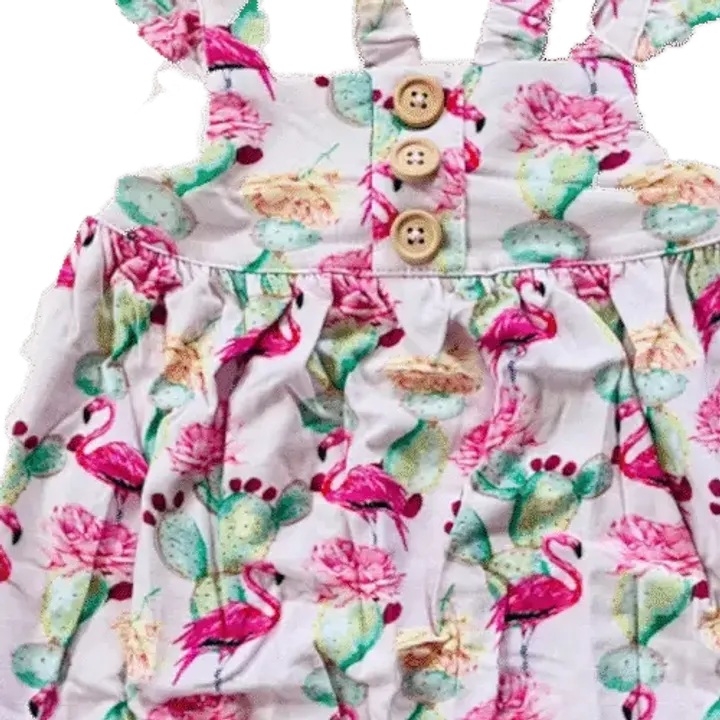 A close crop of the real Prickled Pink fabric, buttons and all