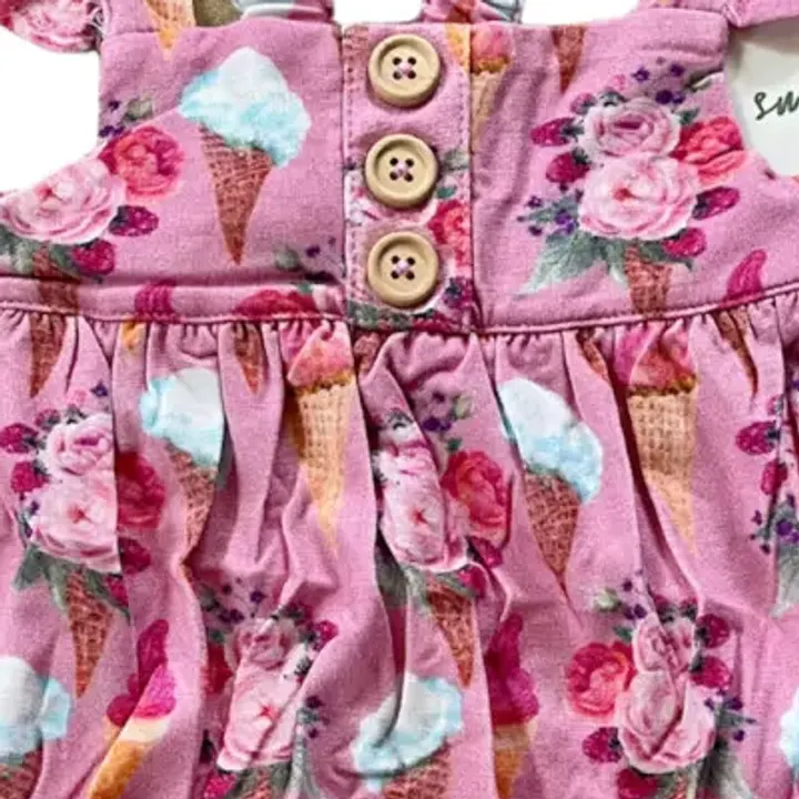 A close crop of the real Sweet Blooms fabric, buttons and all