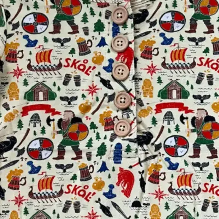A close crop of the real Viking Adventure fabric, buttons and all